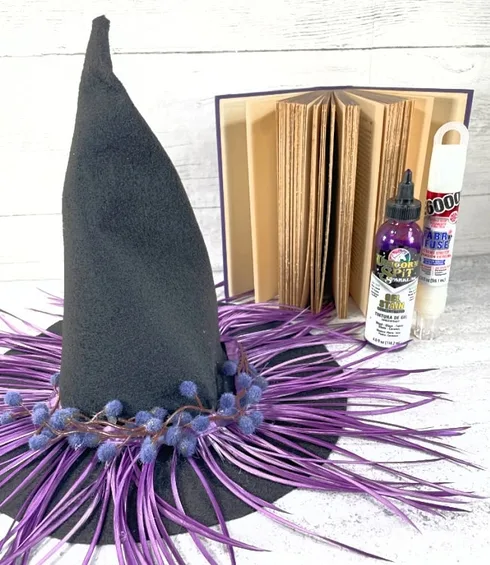 Felt Witch Hat DIY with Dyed Feathers - Laura Kelly's Inklings Create your own unique felt witch hat with dyed feathers using this fun and easy DIY tutorial from Laura Kelly's Inklings. Add a personal touch to your Halloween costume with this stylish accessory that is sure to make you stand out from the crowd.